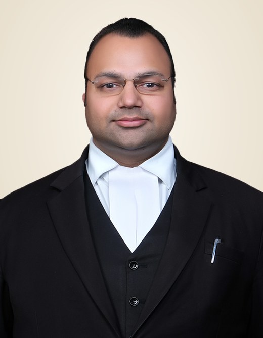 Advocate Gagandeep Goel in an advocate's black coat and white bands